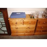 A stripped pine chest of two short and two long dr