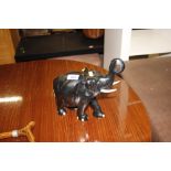 An ebony elephant complete with tusks