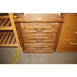 An oak chest fitted three drawers