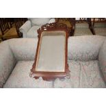 A 19th Century mahogany fret carved wall mirror in