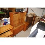 A G-plan design teak bookcase fitted glazed slidin