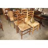 Two pairs of ladder back dining chairs