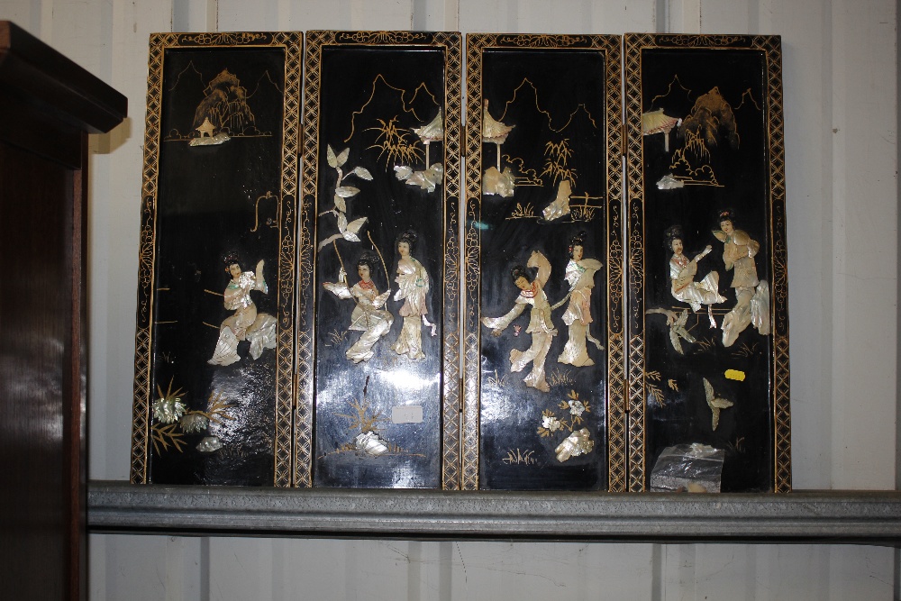 An oriental black lacquered and mother of pearl four fold table screen AF