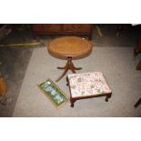 A small floral embroidered footstool on cabriole s