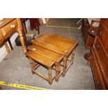 A nest of three oak graduated occasional tables