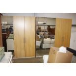 A large Ikea beech and mirror fronted wardrobe unit