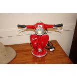 A novelty table lamp in the form of a red vespa sc