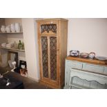 A stripped pine and leaded glazed upright kitchen