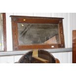 A 1930's oak bevel edged wall mirror