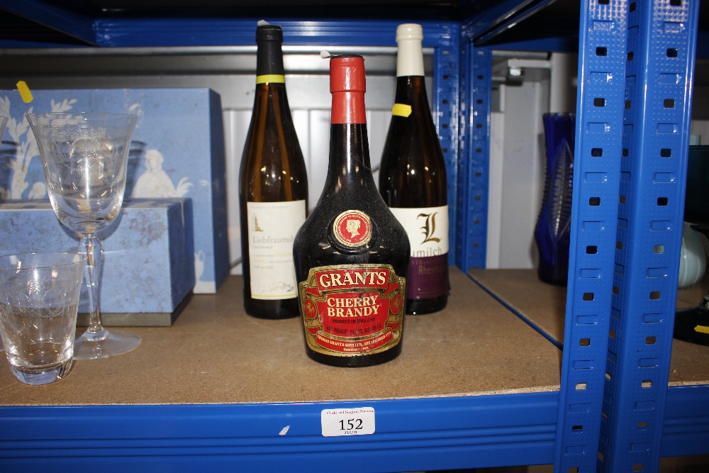 Two bottles of Liebfraumilch and a bottle of cherry brandy