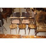 Three Edwardian elm seated stick back kitchen chai