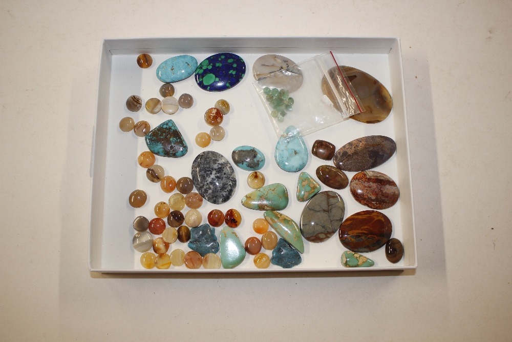 A tray of hard stone and turquoise mounts etc.