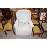 A pale blue upholstered electric reclining easy ch