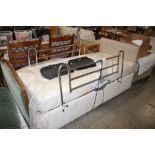 An electric adjustable bed with side rails and mattress