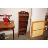 An Edwardian mahogany open fronted bookcase