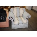 A striped upholstered armchair