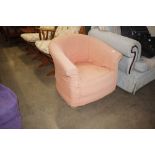 An upholstered tub chair