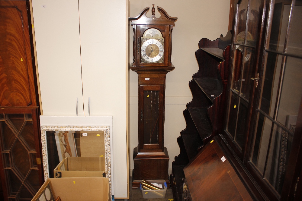 A modern mahogany cased chiming grandmother clock