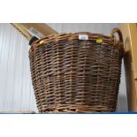 A wicker log basket, tennis racket etc.