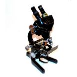 A Watson Barnet microscope with binocular attachment