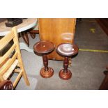 A pair of mahogany occasional tables having circul