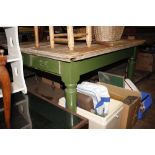 A scrubbed pine topped kitchen table with painted