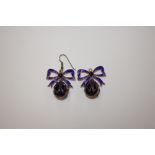 A pair of silver and enamel egg shaped ear-rings