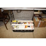A suitcase and contents of various posters, prints