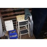 A step stool; and a folding chair
