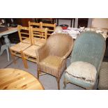 A gold coloured Lloyd loom armchair