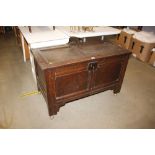 An oak and elm panelled coffer