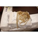 A quantity of assorted linen, table cloths, curtai