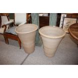 A pair of large terracotta garden planters