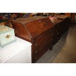 A Georgian mahogany bureau fitted three long drawers