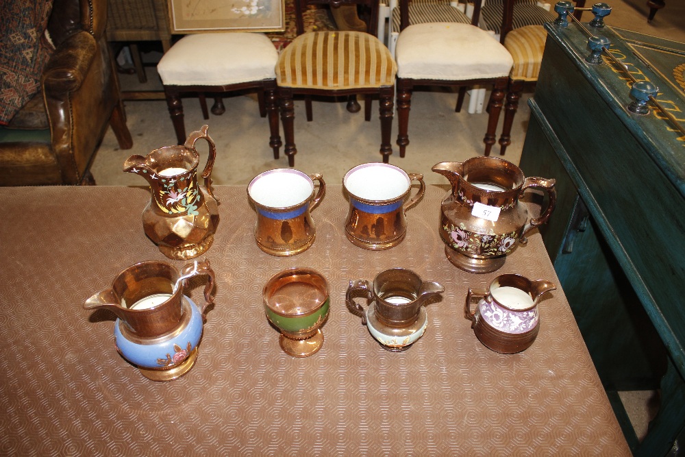 A quantity of 19th Century copper lustre jugs and mugs