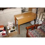 A Formica drop leaf kitchen table