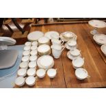 A Mintons part teaset with basket weave ground and