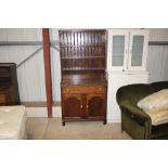 A 20th Century oak dresser raised on cupboard base