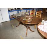 An extending D end dining table