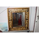 A painted and decorated wall mirror