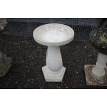 A composition modernist style bird bath