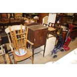 An Edwardian inlaid mahogany side cupboard with pi