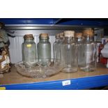 A quantity of glass storage jars and a glass bowl