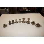 A collection of various silver and plated dwarf ca