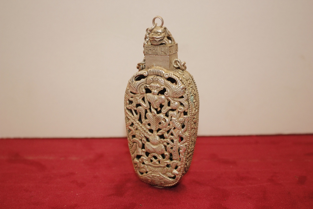 A Chinese pierced white metal bottle