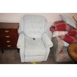 A pale blue upholstered electric reclining easy ch