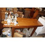 A Glasswells teak folding dining table