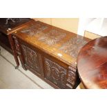 A carved oak coffer