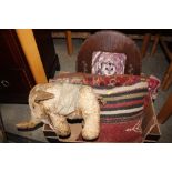 Two antique covered cushions; a vintage stuffed el