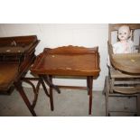 A mahogany butler's tray on folding stand